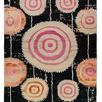 Orbit Bloom Hand Tufted Rug featuring an abstract design with concentric circles in pink and orange on a black background. This vibrant wool area rug is perfect for adding a touch of vintage charm to your living room or dining room. Ideal for those seeking an 8x10 living room rug that combines style and functionality.