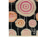 Colorful Orbit Bloom Hand Tufted Area Rug with abstract circular patterns in vibrant pink and orange tones, perfect for adding a vintage touch to your living room or dining room. This wool rug is available in an 8x10 size, ideal for enhancing any space with its bold design.