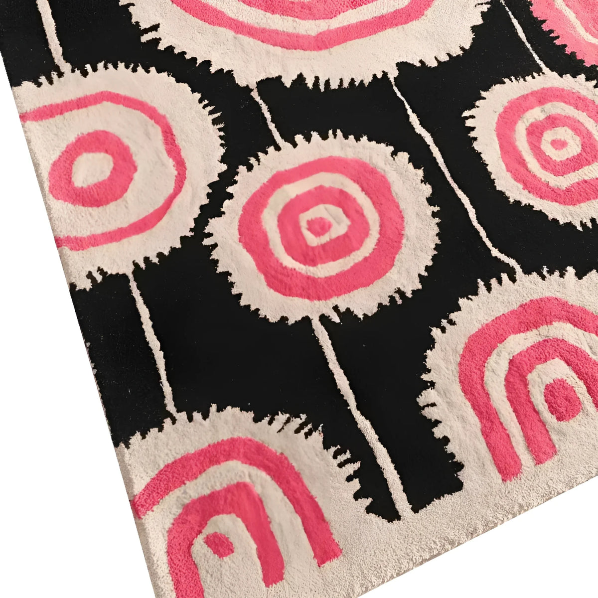 This Orbit Bloom Hand Tufted Rug features a striking abstract design with bold pink and cream circular patterns on a black background, perfect for adding a vintage touch to living room and dining room spaces. Ideal as an 8x10 area rug, this wool rug combines style and comfort for any modern decor.