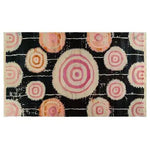 Vibrant Orbit Bloom Hand Tufted Area Rug in a striking abstract design with concentric circles in pink and orange hues on a dark background, perfect for adding a vintage touch to your living room or dining room. This 8x10 wool rug blends modern artistry with a cozy feel, making it an ideal choice for living room and dining room rugs.