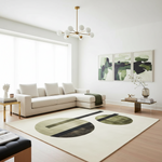 Modern living room with a white sectional sofa, abstract art, and a geometric rug.