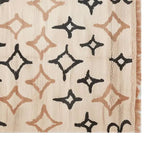 A contemporary wool rug featuring an abstract geometric pattern in black and beige tones. This area rug, ideal for living rooms, adds a stylish touch to any space. Perfect for those seeking an 8x10 size rug that combines elegance with modern design.
