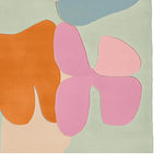 Top view of a colorful area rug featuring an organic abstract design with bold shapes in orange, pink, and blue tones. This contemporary wool rug is perfect for adding a vibrant touch to your living room. Ideal as an 8x10 area rug for living room spaces, it combines modern aesthetics with cozy comfort.