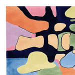 A vibrant, abstract design of the Organic Rhythm Mosaic Hand Tufted Rug, perfect for adding a splash of color to any space. This area rug features bold, contemporary patterns in shades of orange, pink, blue, and green, crafted from high-quality wool. Ideal as a large living room rug, measuring 8x10, it brings a modern touch to your decor.