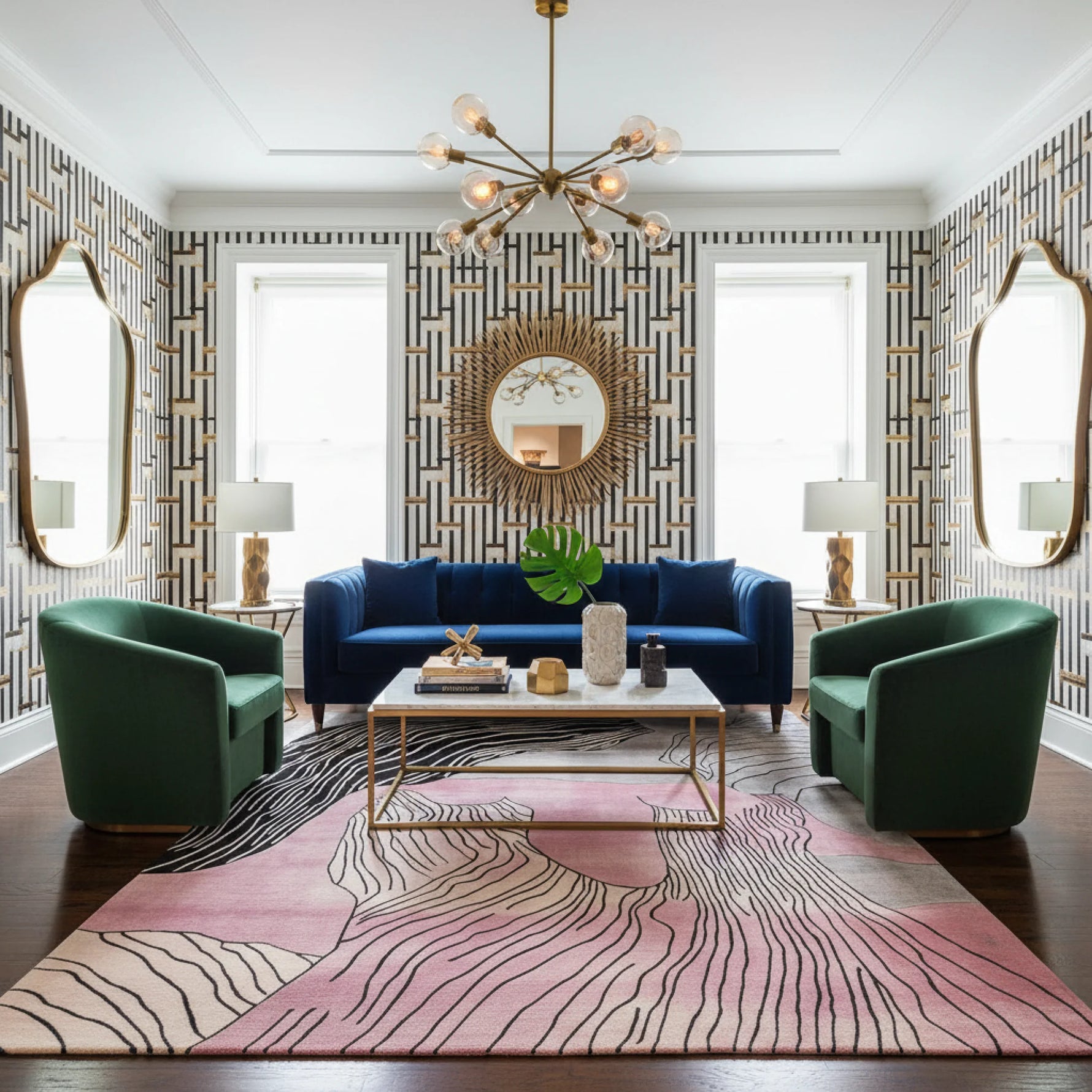 Modern living room with a blue sofa, green armchairs, and decorative elements.