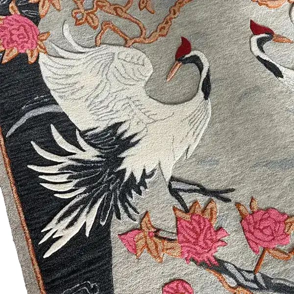 A beautifully detailed Oriental Reverie hand-tufted wool rug featuring elegant cranes and vibrant floral patterns. Perfect as an area rug for the bedroom or living room, this floral rug brings a touch of nature's elegance and sophistication to any space.