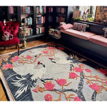 A beautifully detailed hand-tufted area rug with an Oriental Reverie design, featuring elegant cranes and vibrant pink florals. Perfect for adding a touch of luxury to your bedroom or living room, this wool rug creates a warm and inviting atmosphere with its intricate patterns.