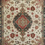 This elegant area rug features an intricate vintage floral design, reminiscent of traditional Persian rugs. The hand-knotted piece showcases a rich blend of earthy tones and detailed patterns, perfect for adding a touch of classic charm to any living room. Ideal for 8x10 spaces, this floral rug is a timeless addition to your home decor.