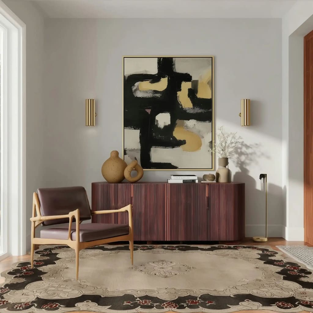 The Ornate Echo Hand Tufted Rug elegantly graces a modern living room, enhancing the space with its vintage design. This large wool area rug features intricate patterns and complements the room's contemporary decor, including a stylish chair and minimalist furniture. Perfect for those seeking living room area rugs that combine classic charm with modern aesthetics.