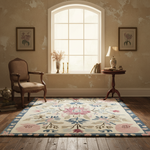 Living room with a floral rug, chair, and lamp near a large window.