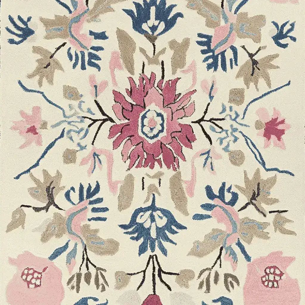 This hand-tufted wool rug features an intricate floral design with vibrant pink, blue, and beige hues. Perfect for adding a touch of elegance to any living room, this large area rug combines beauty and functionality. Ideal for those searching for living room area rugs that offer both comfort and style.