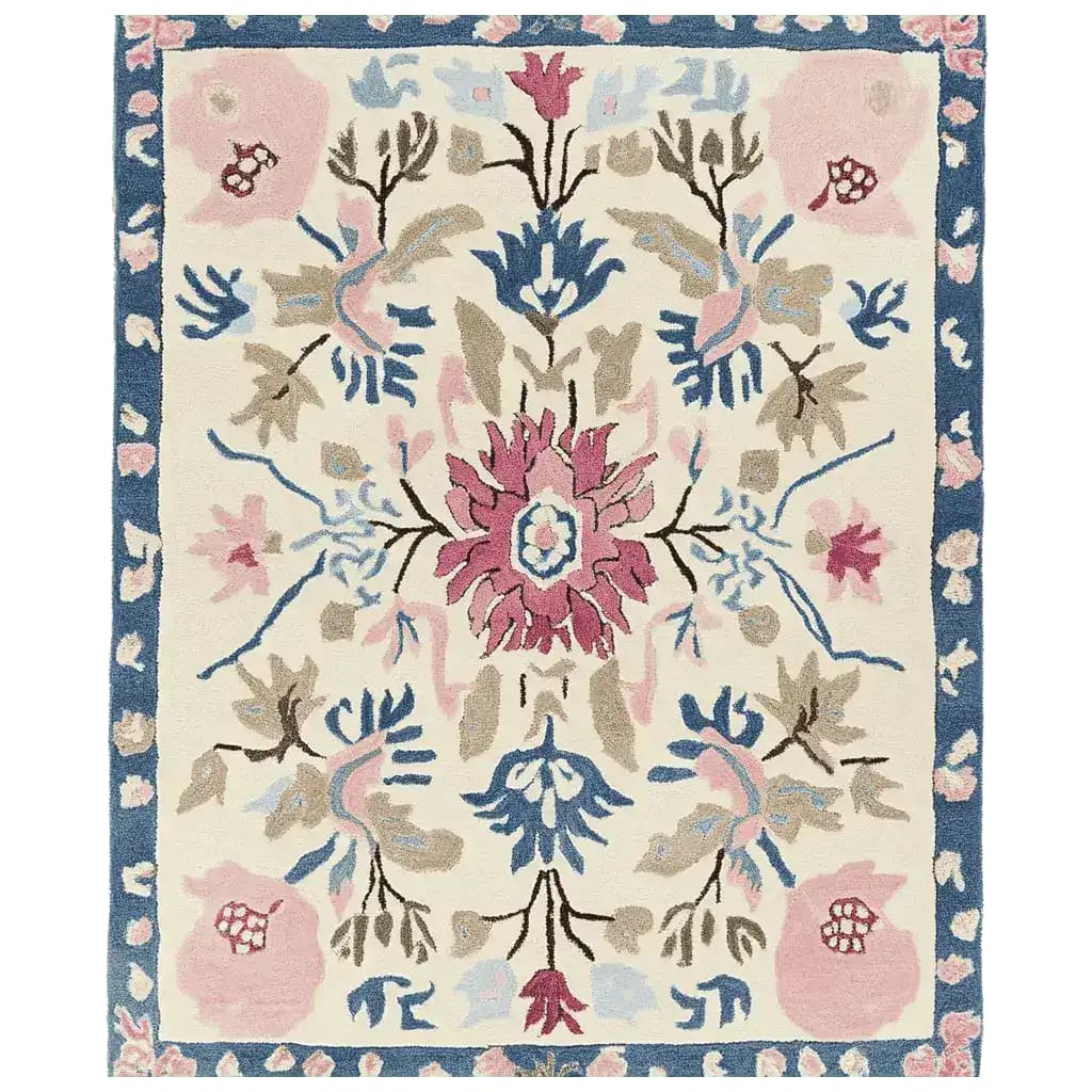 A beautifully crafted ornate flora fringe hand-tufted area rug, showcasing an intricate floral design with vibrant pink, blue, and beige hues. Perfect for adding elegance to living room area rugs. This wool rug is ideal for those seeking large living room rugs with a touch of nature-inspired charm.