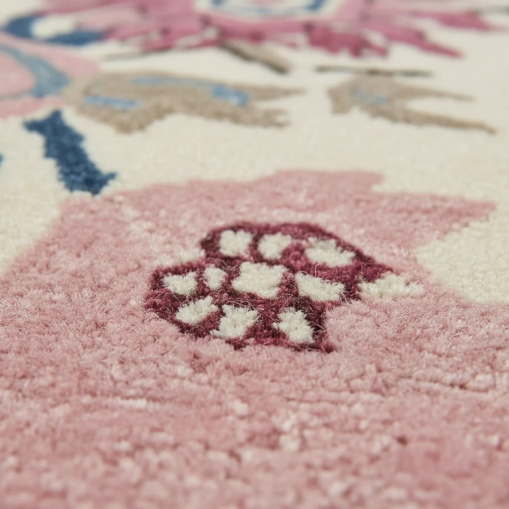 Close-up of a colorful floral-patterned rug with soft focus