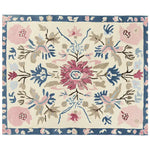 This stunning area rug features an ornate floral design with vibrant pink and blue flowers on a soft cream background, perfect for enhancing any living room. The hand-tufted wool rug combines elegance and warmth, making it an ideal choice for large living room rugs.