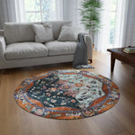 Ornate Floral and Geometric round rug in bright living room with gray sofa and wood floor, bold color contrast pattern visible