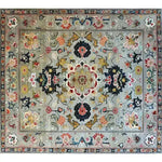 This ornate floral wool area rug showcases a harmonious blend of vintage and Persian-inspired designs, perfect for dining rooms or bedrooms. The hand-knotted viscose and wool create a luxurious feel, making it an ideal choice for a formal dining room or as a centerpiece in rugs for bedrooms.