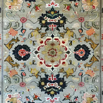 This image showcases an Ornate Floral Harmony Hard Viscose Hand Knotted Wool Rug, perfect for adding a touch of elegance to your dining room or bedroom. The vintage rug features intricate Persian-inspired designs in vibrant colors, making it an ideal choice for formal dining room rugs or as an exquisite wool rug for the bedroom.