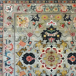 Ornate Floral Harmony Hand Knotted Wool Rug featuring intricate vintage patterns in rich colors, perfect for adding a touch of elegance to dining rooms and bedrooms. This area rug showcases a Persian-inspired design ideal for formal dining room settings and enhancing bedroom aesthetics.