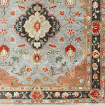 Close-up view of an Ornate Shadow Floral Hand Knotted Area Rug featuring a vintage Persian design with intricate floral patterns. Perfect for enhancing living room decor, this floral rug showcases a harmonious blend of earthy tones and detailed craftsmanship, ideal for those seeking elegant area rugs for the living room.