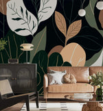 Oversized botanical leaf mural in dining room with arched doorway, round table and gray chairs