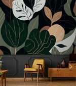 Oversized botanical leaf wallpaper over dark wainscot with yellow midcentury chair and walnut sideboard