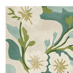 A close-up view of the Painterly Petal Dream Hand Tufted Rug, showcasing its elegant floral design in soft green and blue hues. This contemporary wool area rug is perfect for adding a touch of sophistication to living room spaces. Ideal as a living room area rug, it combines style and comfort, making it a great choice for those seeking beautiful rugs for the living room.