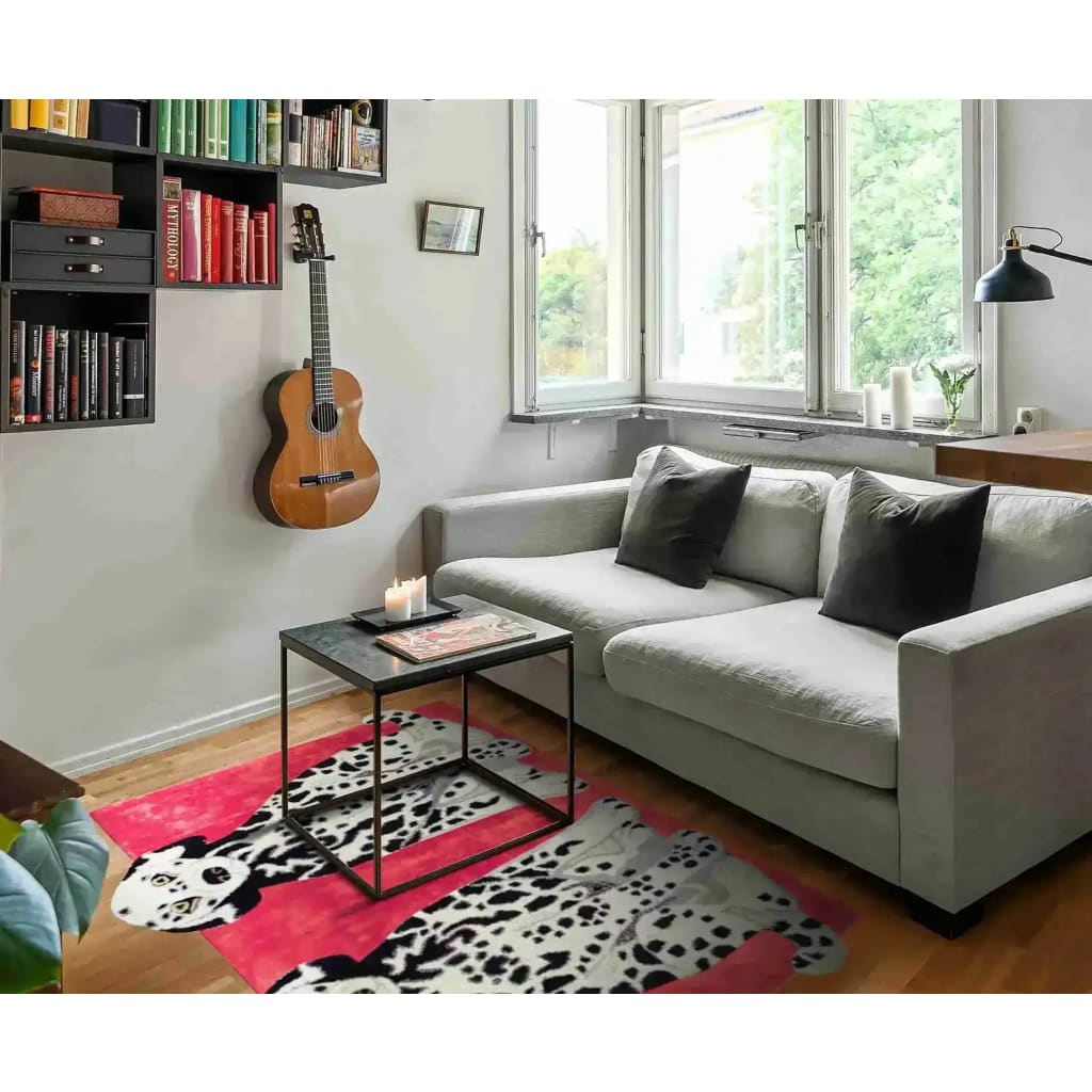 Stylishly decorated living room featuring a contemporary wool rug with a playful dog design on a vibrant red background. This 8x10 area rug adds a touch of vintage charm and color to the space, complementing the neutral sofa and modern decor elements like the wall-mounted guitar and bookshelves.