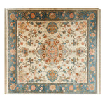 Beautiful knotted wool area rug featuring an intricate floral design with a striking medallion center. The rug, perfect for adding elegance to any space, showcases a blend of warm and cool tones ideal for living room settings. A must-have for those seeking an 8x10 floral rug to complement their home decor.