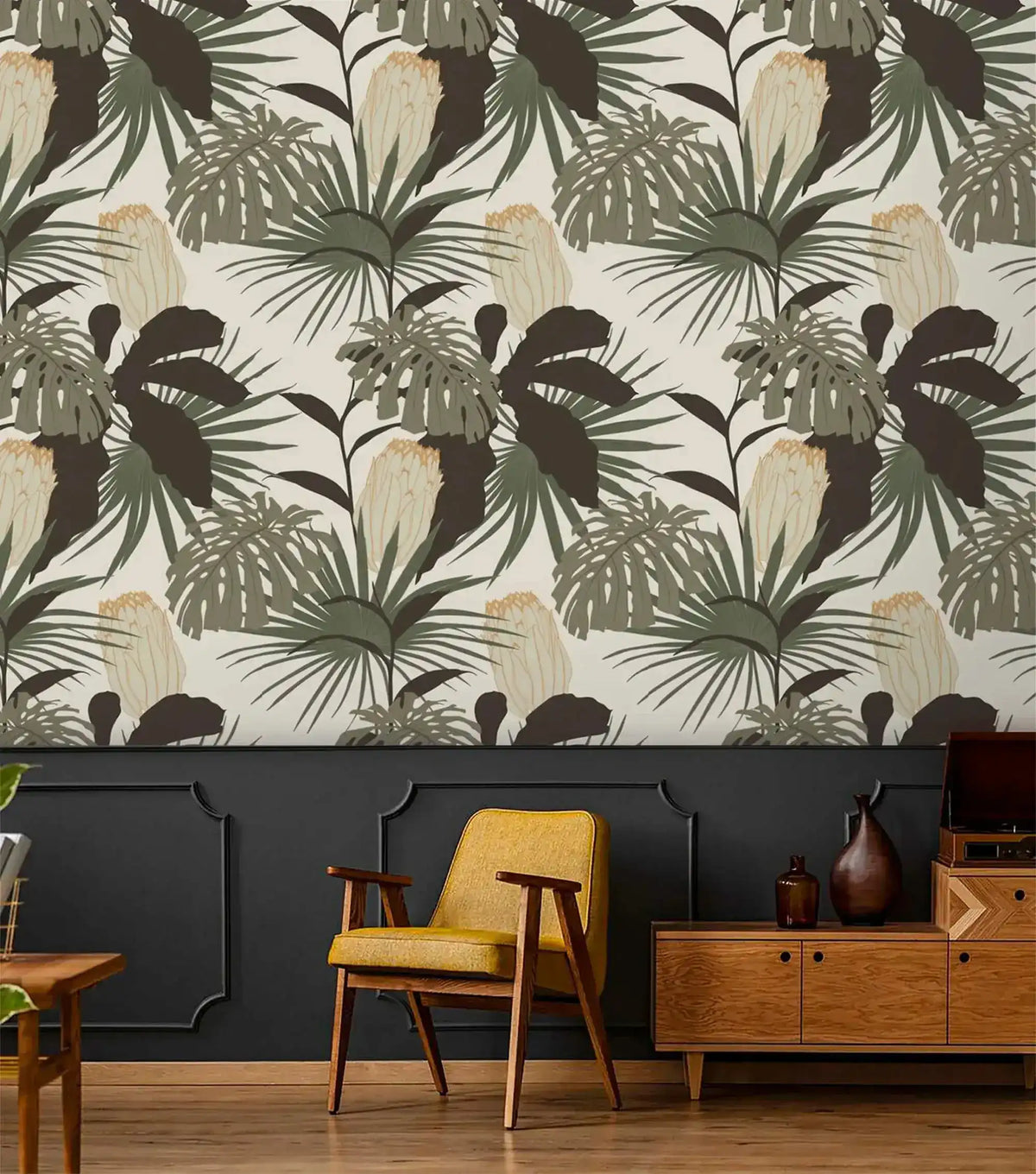 Vintage Glamour palm and monstera wallpaper above dark wainscoting; retro room with mustard armchair and wood sideboard