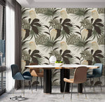 Palm and Monstera Grandeur wallpaper in modern dining room; dark and sage leaves on cream with round marble table