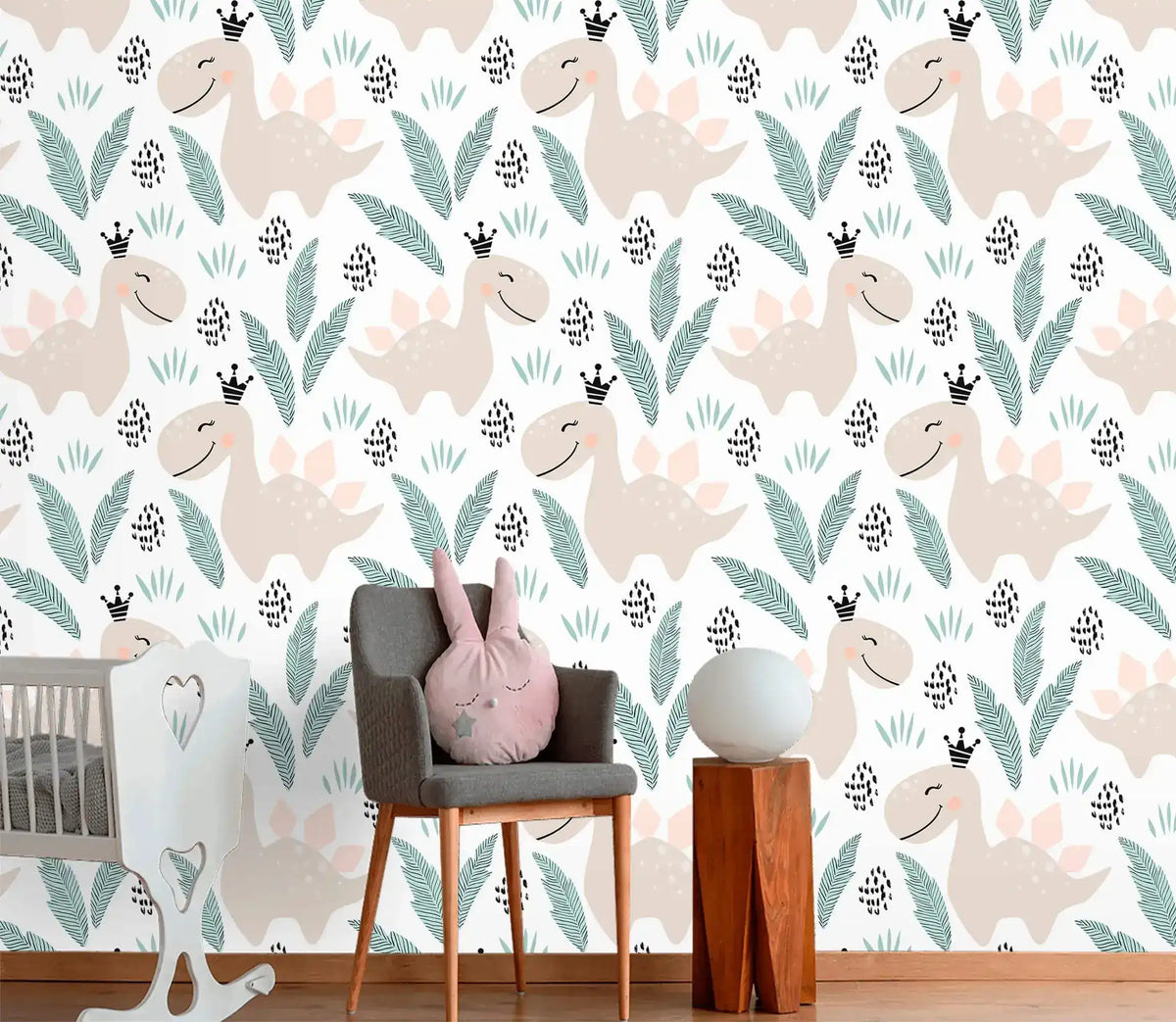 Pastel dino playground wallpaper close-up with smiling beige dinosaurs and leaves on white in a nursery