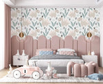 Pastel dino playground wallpaper with beige dinosaurs and leaves on white above a pink arched headboard