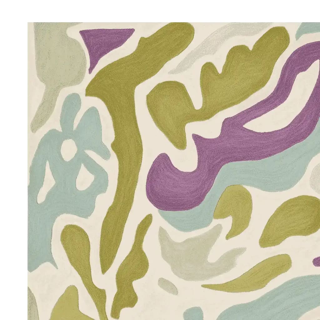 Close-up view of the Pastel Dream Hand Tufted Rug, showcasing its abstract design in soft shades of green, purple, and blue. This contemporary wool rug adds a stylish touch to any living room area, making it a perfect choice for those seeking elegant area rugs for their living space.