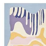 Colorful abstract design of a hand-tufted wool area rug with pastel drips in blue, purple, and yellow tones. Ideal for contemporary living rooms as a stylish and cozy addition.