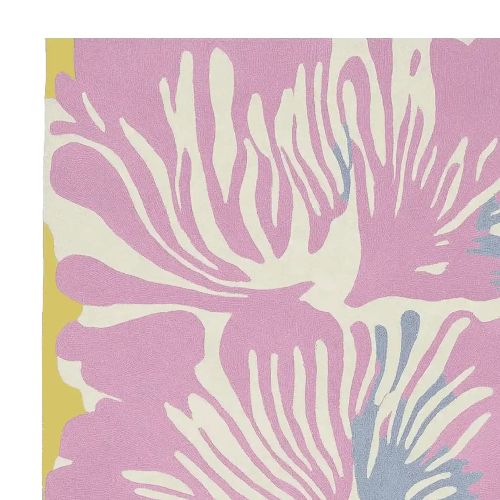 Close-up view of the Pastel Flower Burst Hand Tufted Area Rug showcasing its contemporary design. This wool rug features a vibrant floral pattern in soft pink and cream tones, ideal for adding a modern touch to living room spaces. Perfect choice for those seeking stylish living room area rugs.