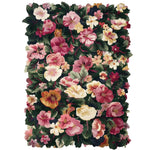 A vibrant area rug featuring a lush floral design with a variety of colorful blossoms, crafted from high-quality wool. Perfect for adding a touch of elegance to any living room, this large rug provides both comfort and style.