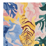 Vibrant and contemporary area rug featuring an abstract tiger design in pastel shades of blue, pink, and yellow. Perfect for adding a touch of modern art to a large living room, this hand-tufted wool rug showcases bold colors and unique patterns, making it an ideal choice for those seeking a stylish and lively centerpiece.