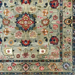 A vibrant pastel medallion blossom area rug, featuring intricate floral patterns reminiscent of vintage Persian rugs. This hand-knotted design showcases a harmonious blend of colors, perfect for adding a touch of elegance to large living rooms.