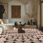 A beautifully designed pastel olive green illusion hand-tufted wool rug graces the living room floor. The area rug features a stunning geometric pattern that complements the modern decor of the room. Perfect for living room rugs 8x10, this wool rug adds elegance and warmth to any bedroom or living space. The rug is surrounded by contemporary furniture, including a white sofa and a wooden table, creating a cozy and inviting atmosphere.