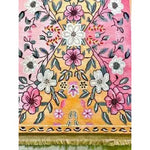 Close-up of the Pastel Paradise Hand Tufted Rug showcasing its vibrant floral design. This elegant area rug features a blend of pink, orange, and yellow hues with intricate flower patterns, perfect for adding a vintage touch to any living room. Made from high-quality wool, this floral rug is a stunning centerpiece for living room area rugs.