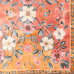 A vibrant, hand-tufted area rug featuring a pastel paradise floral design. The rug showcases a beautiful array of blooming flowers with shades of pink, orange, and cream, perfect for adding a touch of vintage charm to any living room. This wool rug is an ideal choice for those seeking exquisite living room area rugs with a delicate floral motif.