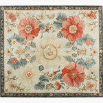 A beautiful area rug with a vintage floral design, featuring vibrant red and cream flowers with green leaves on a light background. This hand-tufted wool rug is perfect for adding elegance to your living room. Ideal as a large area rug, it marries both traditional and artistic elements, making it a standout piece in home decor.