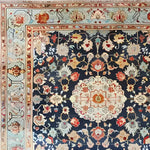A beautifully detailed square area rug featuring a floral design with intricate patterns, perfect for living rooms or offices. This vintage wool rug showcases a Persian style, with vibrant colors and a classic border, making it an ideal choice for those seeking rugs for living rooms with a touch of elegance.