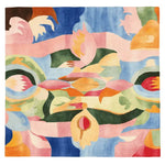 A vibrant and colorful square area rug featuring an abstract patchwork design with a mix of pink, blue, green, and orange hues. This contemporary wool rug is perfect for adding a splash of color to any living room, offering a unique artistic touch to your decor.
