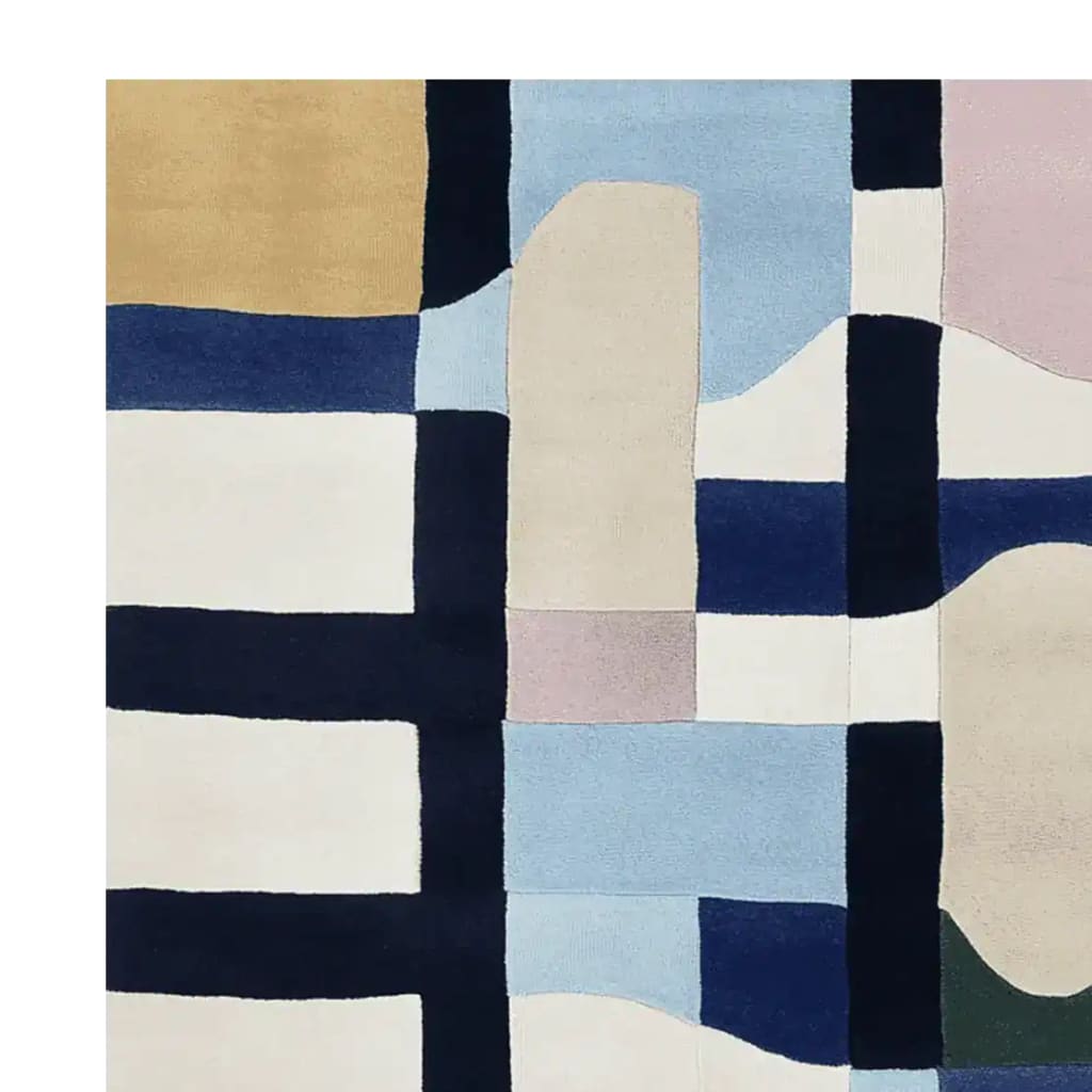 A contemporary hand-tufted wool area rug featuring an abstract geometric pattern. The design includes bold blocks of color in shades of blue, beige, and cream, perfect for a large living room. This stylish area rug adds a modern touch to any space.
