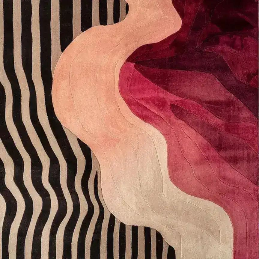 Vibrant hand-tufted area rug featuring a contemporary abstract design with flowing waves of pink, red, and beige, perfect for adding a pop of color to any bedroom. This wool rug combines bold stripes with soft curves, making it an ideal choice for modern bedroom area rugs.