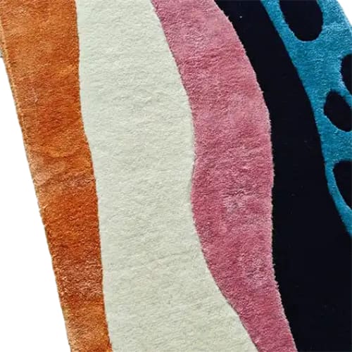 A vibrant and contemporary area rug showcasing an abstract design with bold colors including orange, white, pink, black, and blue. This wool rug serves as a perfect kitchen runner rug or hallway runner rug, adding style to any space such as offices or living rooms.