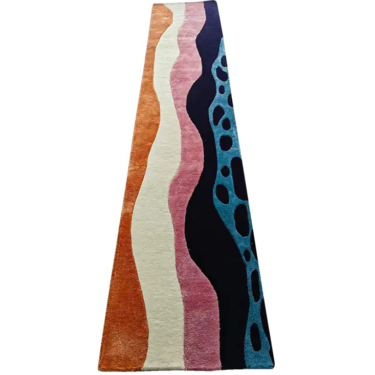 This vibrant hand-tufted wool rug runner features a contemporary abstract design with wavy patterns in orange, cream, pink, navy, and blue. Ideal as an area rug for kitchens, hallways, and offices, it adds a modern touch to any space. Perfect for those seeking kitchen runner rugs, hallway runner rugs, or large area rugs for living rooms.