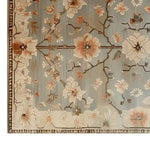 Elegant area rug featuring a hand-tufted wool design with peach blossom patterns on a soft blue background, perfect for large living rooms. This exquisite wool rug adds a touch of nature-inspired elegance, making it an ideal choice for area rugs for living room spaces.