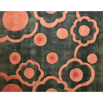 A vibrant hand-tufted area rug featuring abstract peach and coral floral designs against a dark background, perfect for adding a stylish touch to your bedroom or dining room decor. This wool rug combines modern elegance with soft textures, making it an ideal choice for bedroom rugs.
